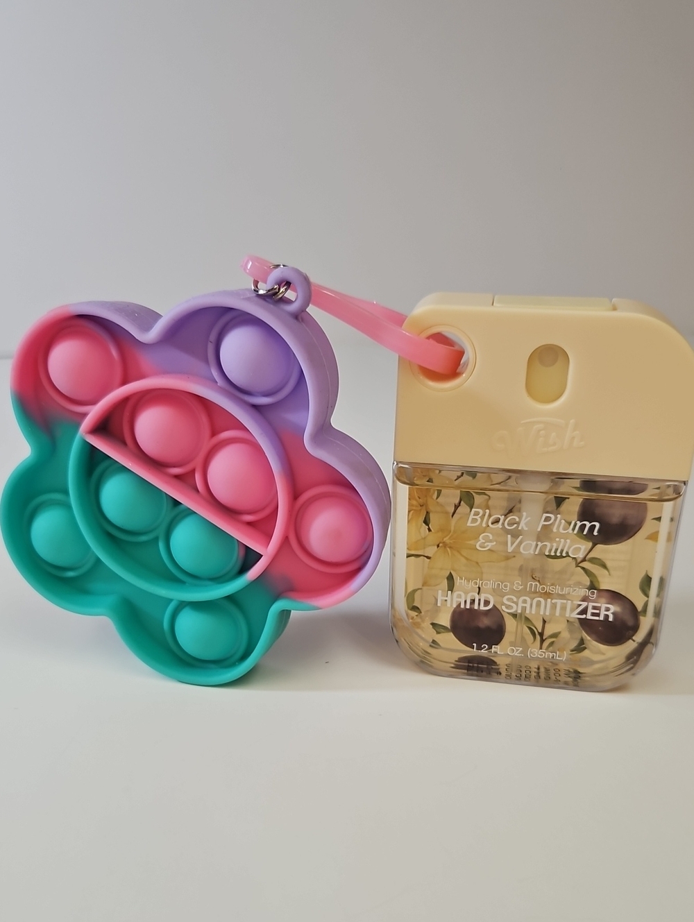 Wish BLACK PLUM & VANILLA HAND SANITIZER + FLOWER FIDGET KEYCHAIN